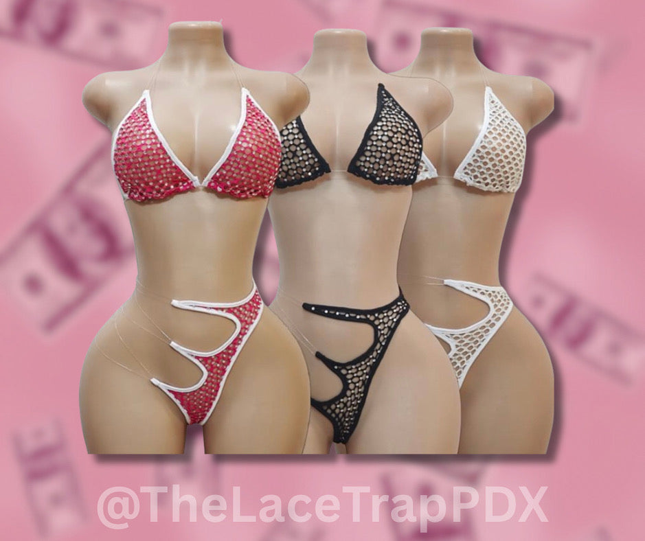 Set of lingerie on mannequins with a pink background and 'TheLaceTrapPDX' branding.