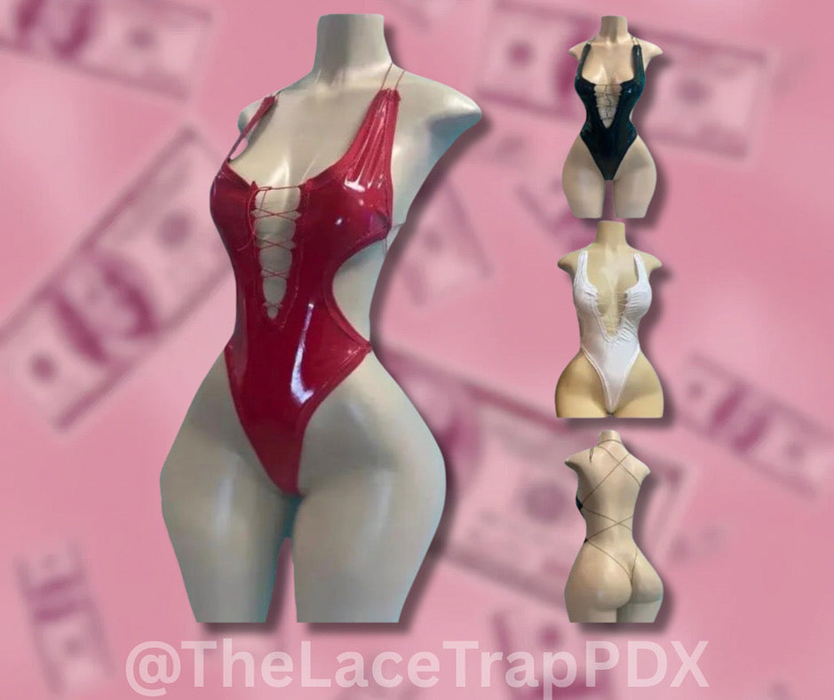 Red faux leather lingerie on a mannequin with multiple mannequins in different poses  and color options against a pink background.