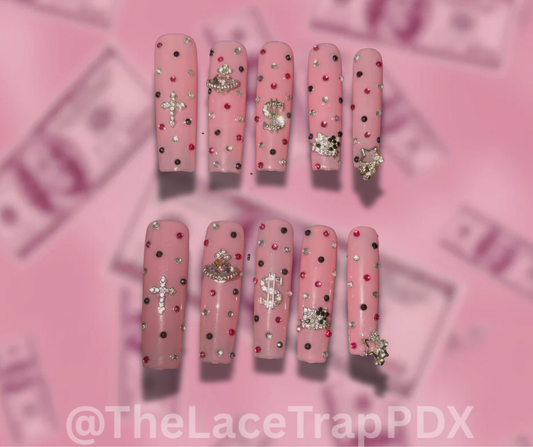 Set of pink nail art with decorative elements on a pink background with 'TheLaceTrapPDX' branding.