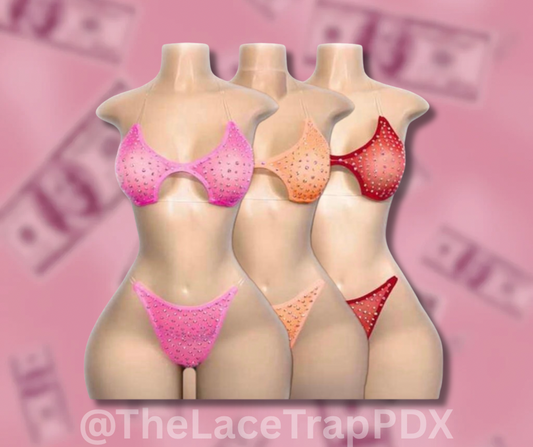 Three mannequin bodies wearing colorful lingerie against a pink background with blurred text.